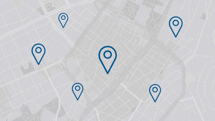 Peta dengan beberapa penanda lokasi biru di latar belakang abu-abu terang.