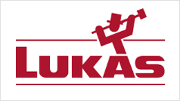 Logo Lukas dengan tulisan merah dan sosok dengan palu.